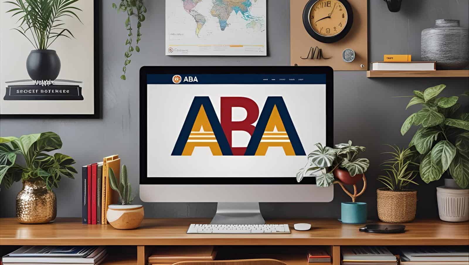 Modern home office with ABA website on screen, surrounded by plants and books.